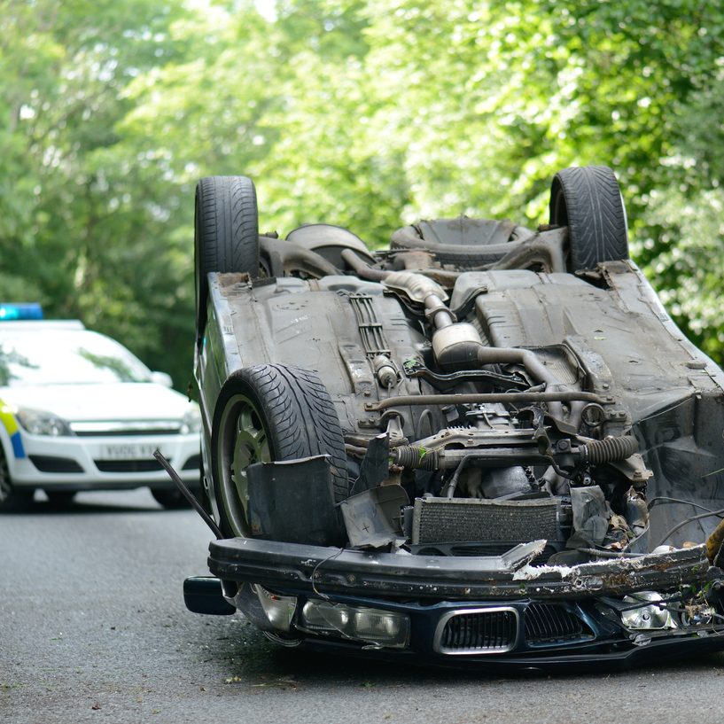 Car accident crash flipped upside down, road closed by police